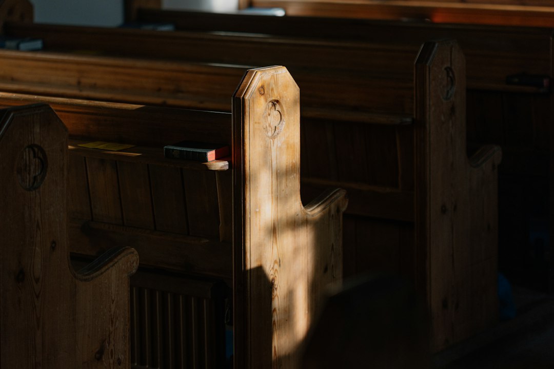 A close up of a wooden church pews